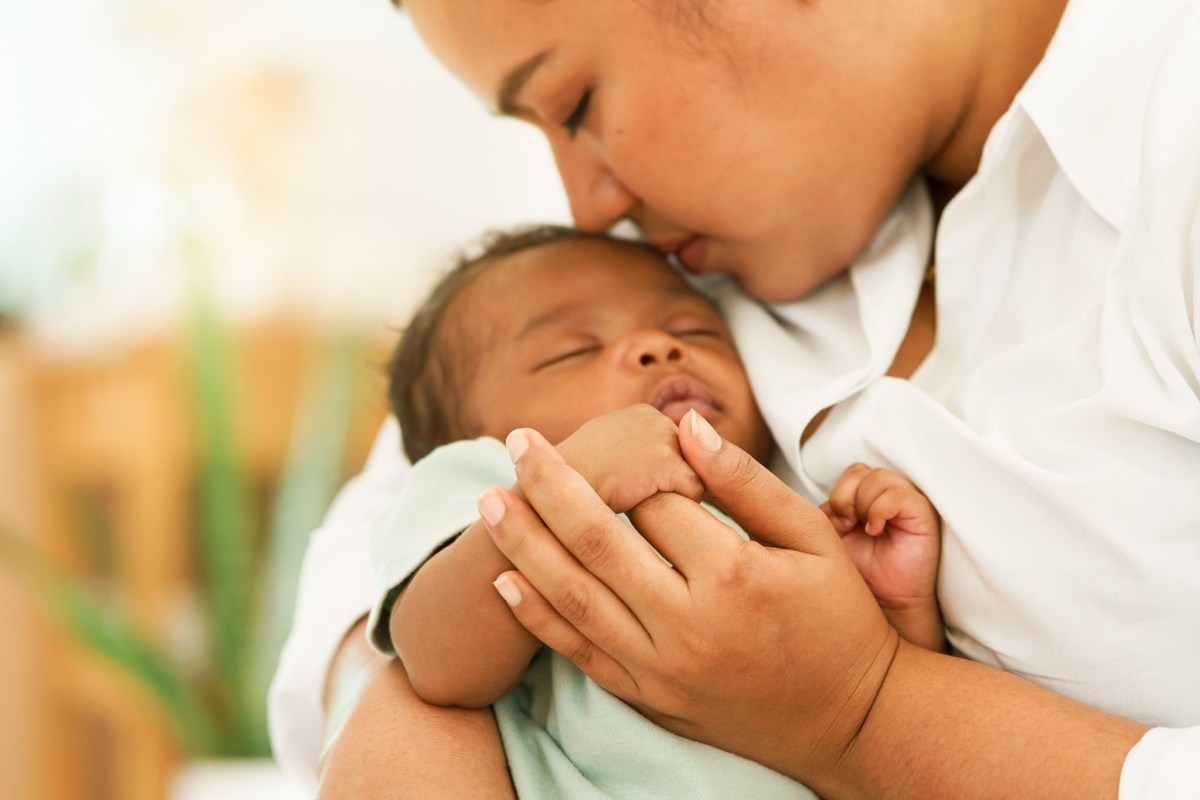 A woman holding a baby