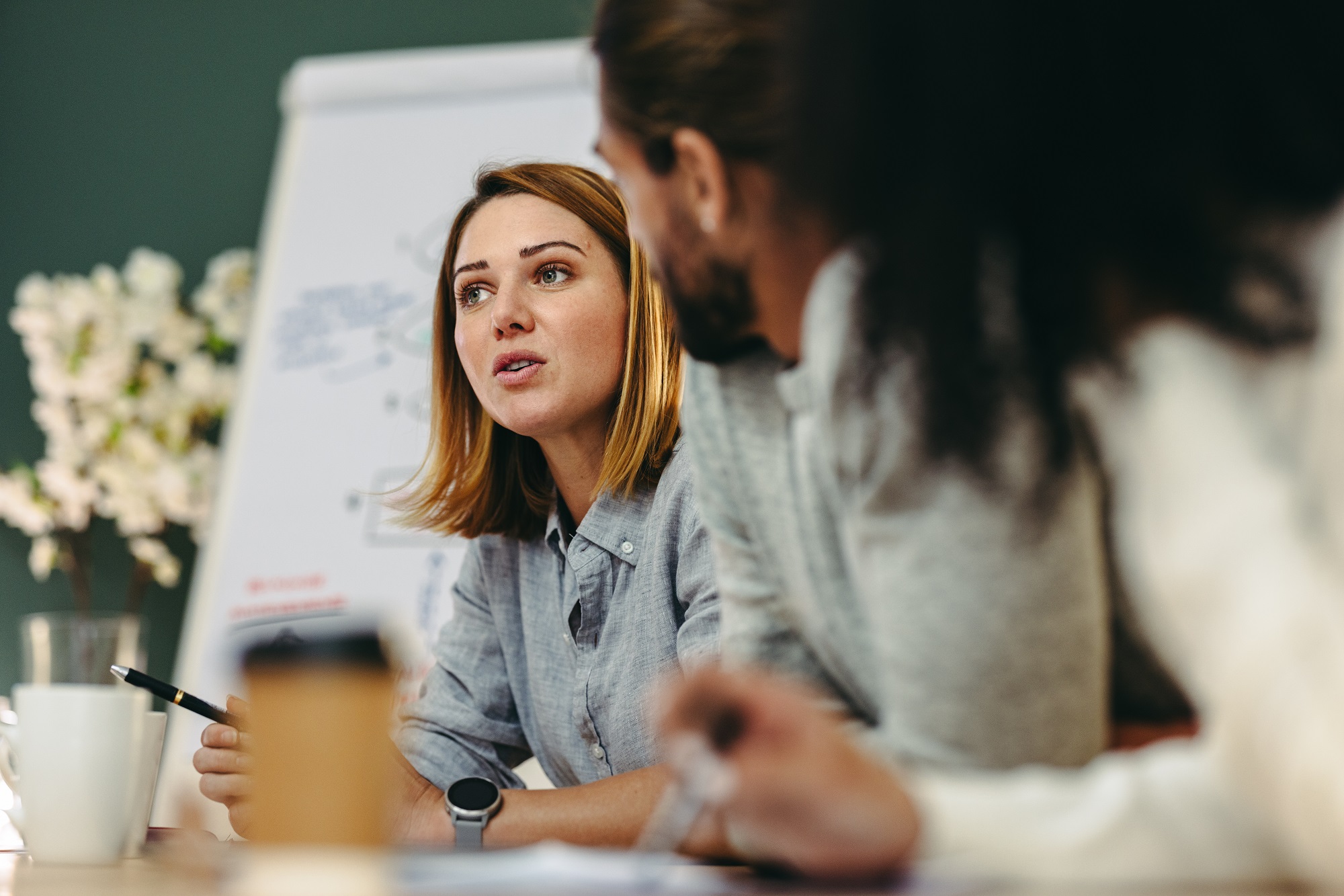 Consultant sharing ideas in a meeting