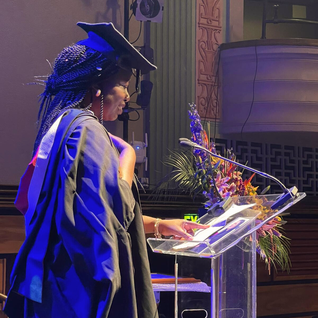 A black female graduate at her graduation ceremony. 