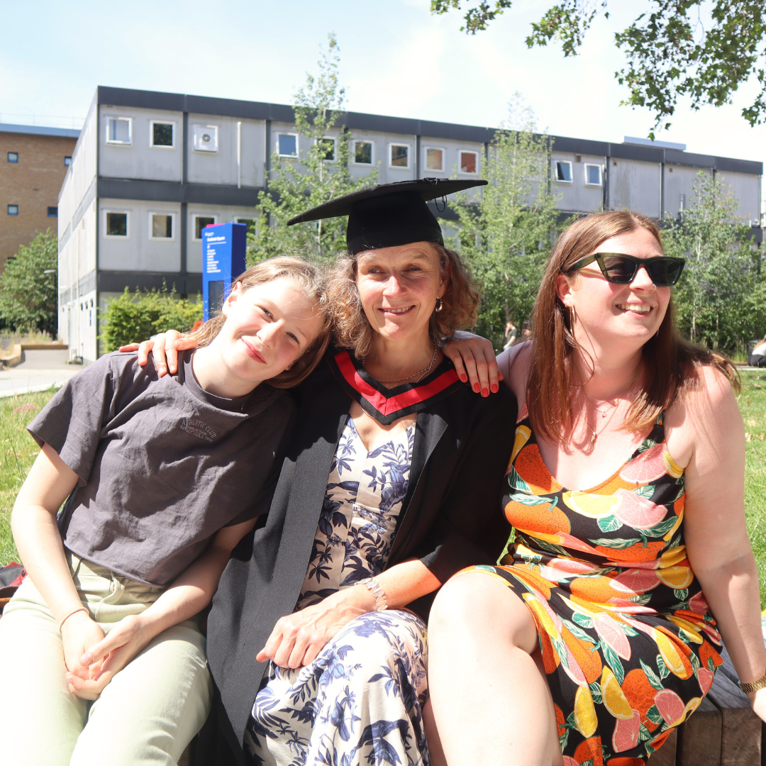 A female graduate with her family. 