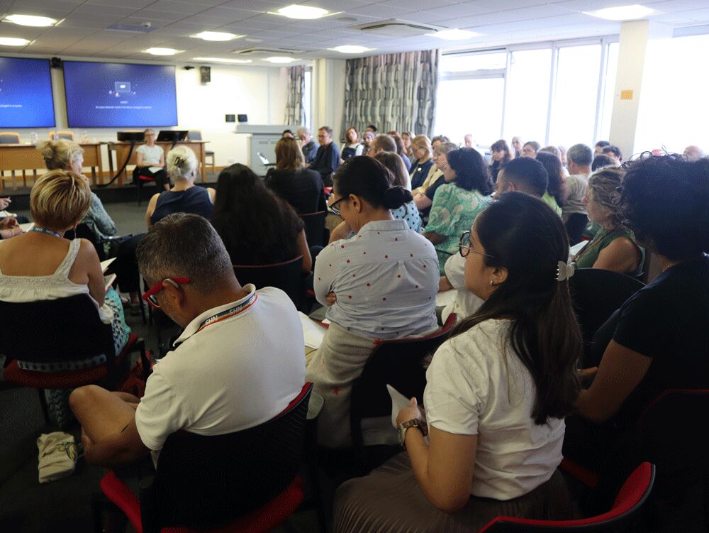 Audience Watching Presenter at Doing Difference Differently Seminar