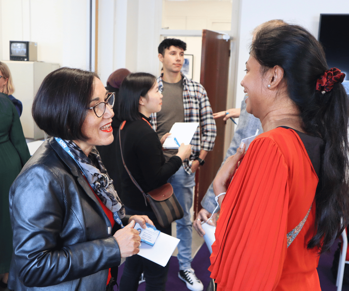 Elisa Reyes Simpson chats to a student