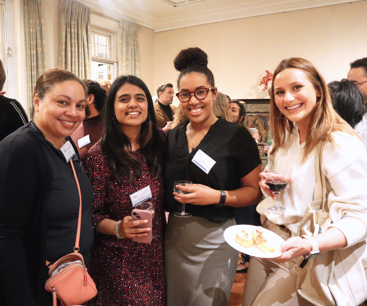 Group of four alumni at networking event