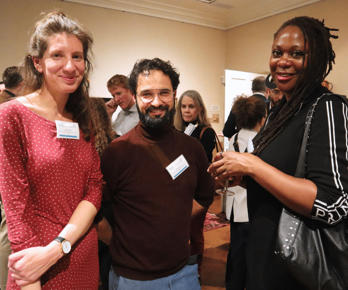 Group of three alumni at networking event