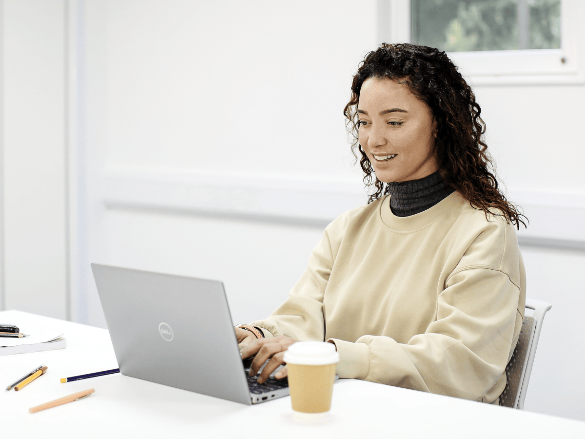 Female student working at laptop