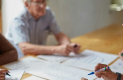 Professionals discussing papers in a meeting