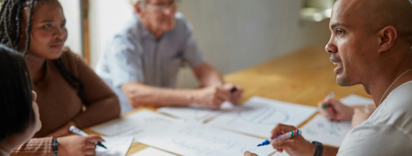Professionals discussing papers in a meeting