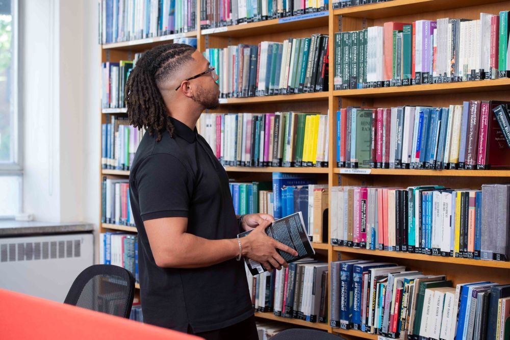 Student browses books in library
